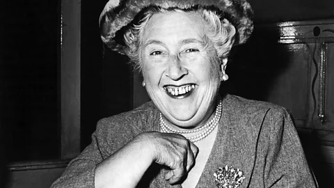 Getty Images Black and white image of Agatha Christie smiling at the camera (Credit: Getty Images)