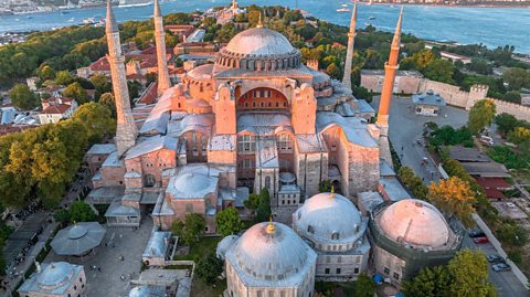 The Hagia Sophia is seen at sunset, overlooking the Bosphorus River in Istanbul