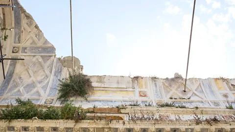 Getty Images The ruins of the original Gibellina, abandoned after the 1968 earthquake, sit in contrast to the ambitious modern town built several kilometres away (Credit: Getty Images)