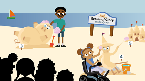 A sandcastle building competition in front of an audience, with a sand pig, a sand witch and a sandcastle.