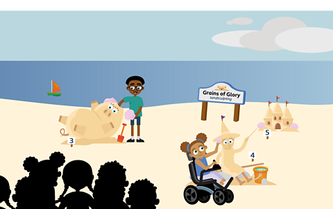 Contestants building a sand pig and a sand witch in front of an audience in the Grains of Glory, sandcastle competition. 