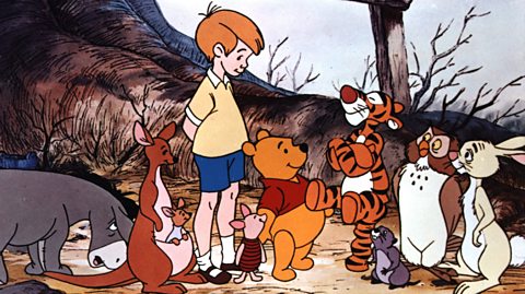 In a still from a Winnie the Pooh Disney film, from left to right, Eeyore, Kanga and Roo, Christopher Robin, Piglet, Pooh, Tigger, Owl and Rabbit