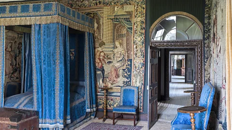 Alamy Curtains and textiles helped retain heat in the bedroom (Credit: Alamy)