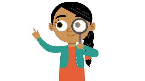 Isma with a magnifying glass