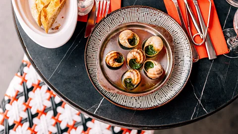 Getty Images Snails on a plate at a bistro (Credit: Getty Images)