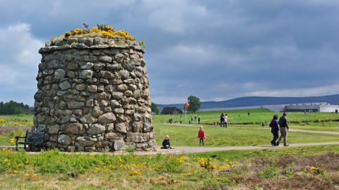 A stone memorial in a field at the site of the Battle of Culloden