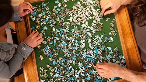 A group playing with puzzles.