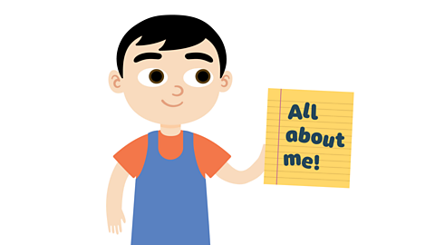 A boy holding a piece of paper that says All about me