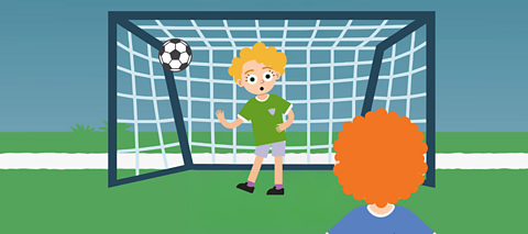 An illustration of a child in goal while another child scores a goal.