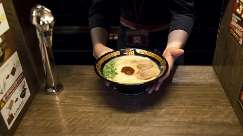Getty Images The single-seat booths at Ichiran are designed to minimise noise and interaction (Credit: Getty Images)