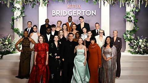 The cast of season four's Bridgerton all pose for a photo on the grand carpet