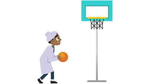 a young boy looking up at a basketball net with a ball in his hands