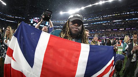 Philadelphia Eagles' Jay Ajayi holds a Union Jack to pose for pictures after winning Super Bowl LII