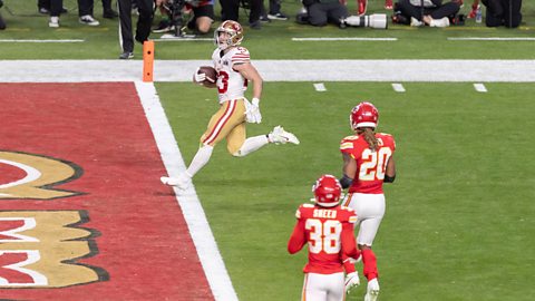 Christian McCaffrey of San Francisco 49ers runs for touchdown to 10:0 during the Super Bowl LVIII match between San Francisco 49ers and Kansas City Chiefs