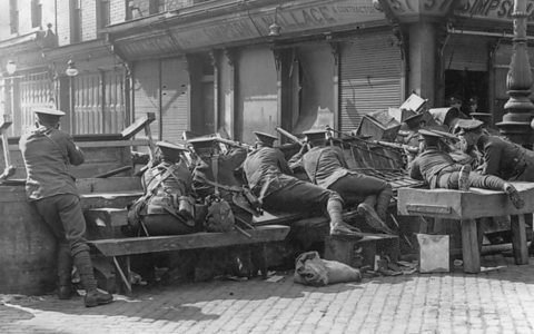 British soldiers behind a makeshift barricade during the Easter Rising, 1916.