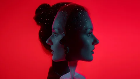 Getty Images/ BBC Portrait of a woman in profile against a red background duplicated so she is looking left and right (Credit: Getty Images/BBC)