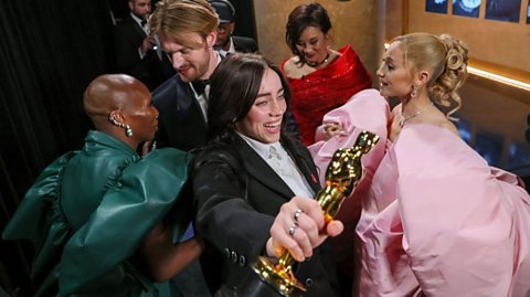 Billie Eilish, Finneas O'Connell after winning Best Song at the 96th Annual Academy Awards, presented by Cynthia Erivo and Ariana Grande 