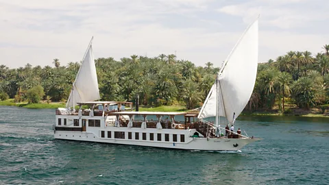 Alamy Egypt tour operators are promoting smaller dahabiyas on the Nile as an alternative to large cruise ships (Credit: Alamy)