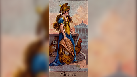 An illustration of Roman goddess Minerva with long brown hair and wearing golden armour and carrying a huge spear. Next to her is a brown old and a brown rooster