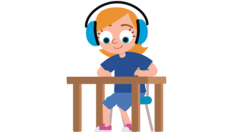 a young girl with headphones on drawing at a desk