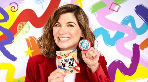 Jodie Whittaker holding up a 'Design-Yer Nose' red nose