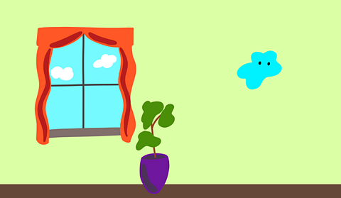 A green wall with a small piece of blue tac on it next to a large window