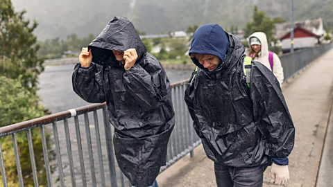 Two students caught in the rain.