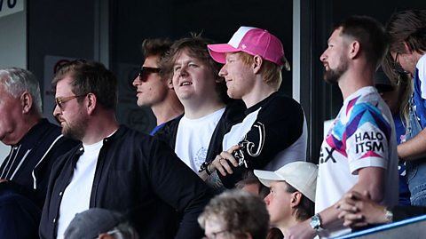 Ed Sheeran and Lewis Capaldi watching an Ipswich Town football match