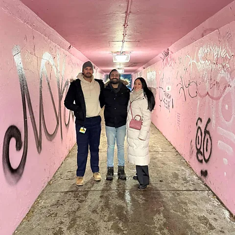 Abbas Jeraj Fans huddle up in Hamilton's pink tunnel, which, thanks to the show, is more famous than before (Credit: Abbas Jeraj)