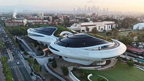 Hathaway Dinwiddi/ Pedro Ramirez An aerial view of Lucas Museum of Narrative Art, a futuristic building which looks like two flying saucers