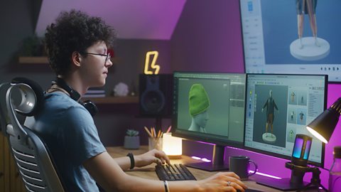 Young 3D designer creates clothes on PC using professional software.