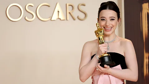 Getty Images Mikey Madison with her best actress Oscar for Anora – one of the lowest budget best picture winners ever (Credit: Getty Images)