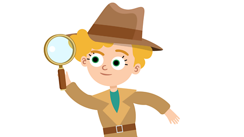 Dash looking through a magnifying glass