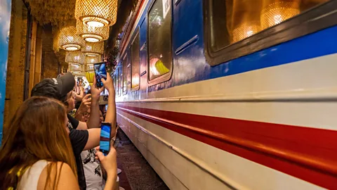 Alamy The rushing of the trains paired with the atmospheric setting are irresistible to tourists (Credit: Alamy)