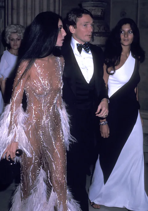 Getty Images Cher and designer Bob Mackie at the 1974 Met Gala – the sheer, beaded gown was among his most iconic designs (Credit: Getty Images)