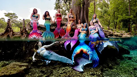Brandee Anthony Media A colony of mermaids poses above and under the water's surface for a photo in Florida's springs (Credit: Brandee Anthony Media)