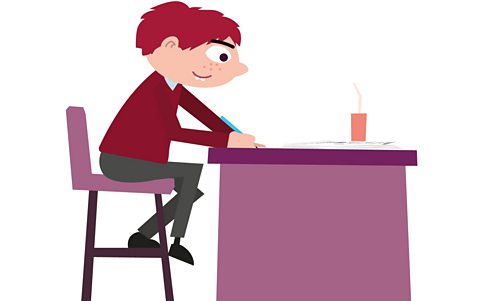 A boy revising for the SEAG transfer test