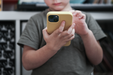 A child using a phone.