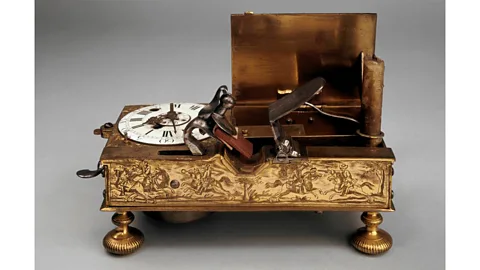 Trustees of the British Museum This 18th-Century spring-driven clock had both an alarm sound and a mechanism to light a candle, which would spring into upright position (Credit: Trustees of the British Museum)