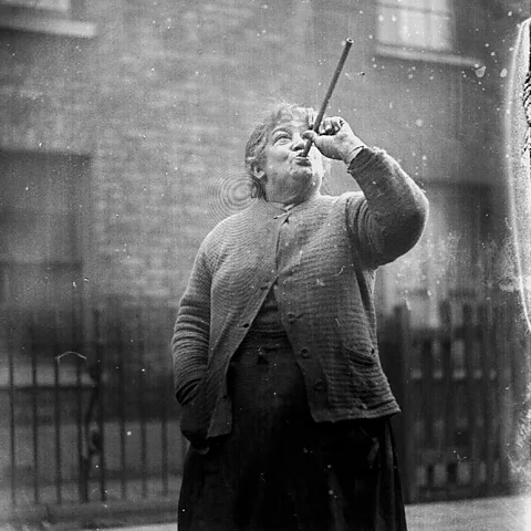 Alamy Mary Smith, a much-loved knocker upper in East London, specialised in shooting peas through a pipe to subtly wake up her clients (Credit: Alamy)