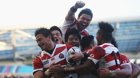 Japan's rugby team celebrates after scoring a try