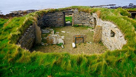 Knap of Howar - remains of a stone structure covered in turf - old farm in Scotland