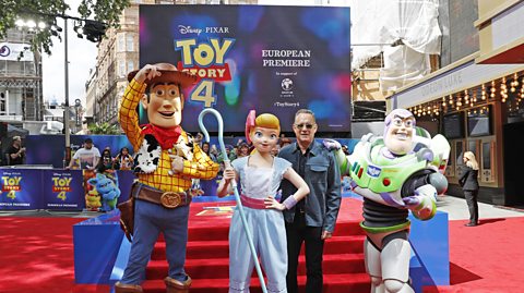 Tom Hanks at the European Premiere of Toy Story 4, with mascot versions of Woody, Buzz and Bo Peep