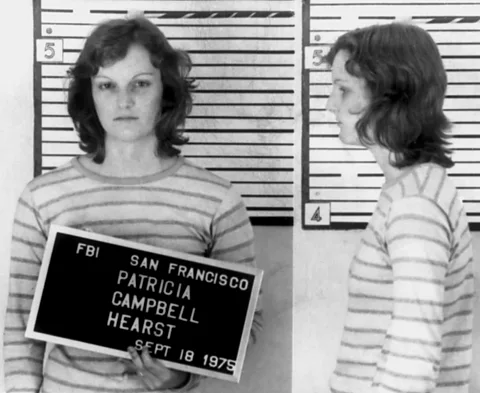 Getty Images Patty Hearst was arrested in 1975, having been on the run for over a year (Credit: Getty Images)