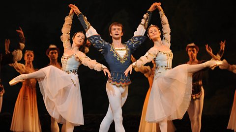 Performers star in Swan Lake in London wearing white dresses and blue costumes