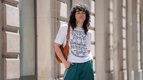 Getty Images Haring's art has become a fashion favourite, printed onto T-shirts and other items (Credit: Getty Images)