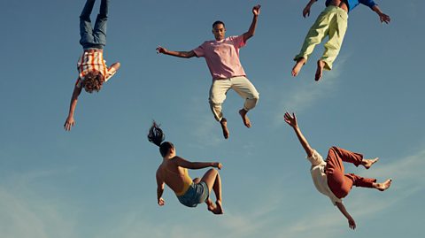 An image of a group of people floating in the air