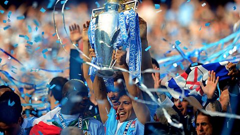 Sergio Aguero of Manchester City celebrates with the trophy