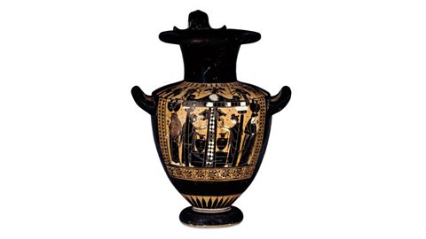 An ancient Greek jar. On its black surface a scene of a fountain-house is painted where figures are shown with jars.