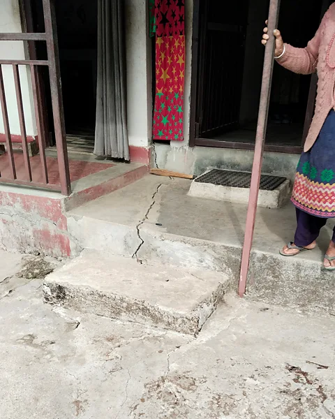 Antoinette Tordesillas The signs of the unstable ground beneath Kimtang village in Nepal are visible in many homes, with cracks appearing in walls and concrete floors (Credit: Antoinette Tordesillas)
